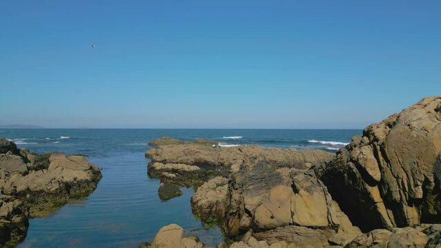 Aerial View Of Rocky Coast And Blue Sea In Summer -  Furna de Caion In A Coru&ntilde;a, Spain. - pullback