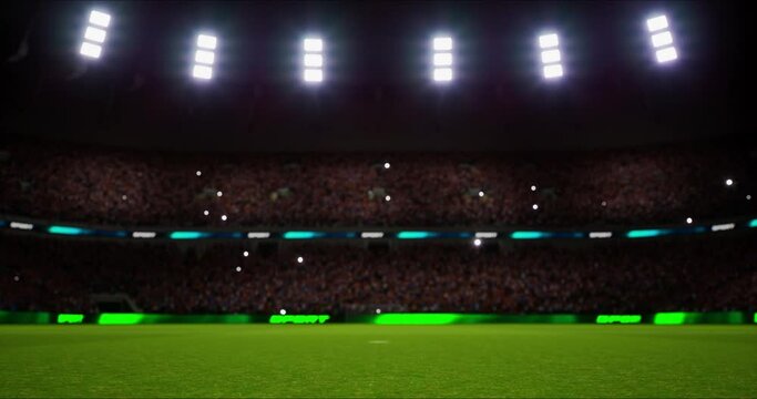 Green grass playground and stadium full of spectators and shining spotlights. Sport event as looped 4k video background.