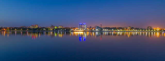 Fototapeta na wymiar Evening panorama of Zaporizhzhia city on Dnieper river, Ukraine