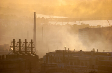 Smoke from metallurgical plants at sunset
