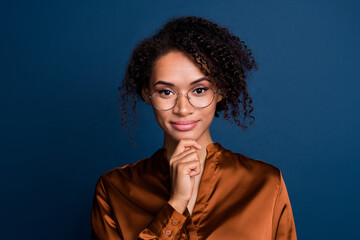 Obraz premium Photo of intelligent smart lady wear silk brown shirt spectacles arm chin smiling isolated blue color background
