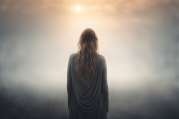 A lonely woman stands with her back feeling the need for love and warmth - obrazy, fototapety, plakaty