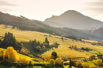 Autumn rural landscape with mountain at sunset. The Orava region of Slovakia, Europe.
