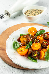 Tomato salad with basil, organic healthy products. Detox and clean diet concept. place for text, top view