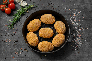 Turkey cutlets in breadcrumbs.