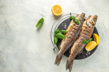 Baked sea Bass fish, grilled seabass with white wine. banner, menu, recipe place for text, top view