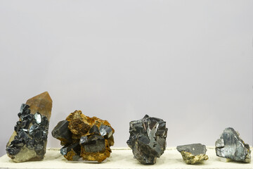 collection of various minerals on gray background : cassiterite stones