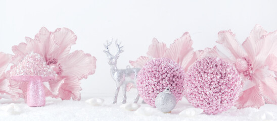 Merry Christmas. Christmas banner in pink color on a white Christmas background. Christmas background, pink xmas holiday card. Christmas card pink balls