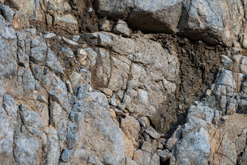 Rock structure, background. Natural rock background. Cracks and natural shapes of rocks