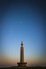 Fotobehang memorial monument Codden hill at sunset with the moon above. © adam