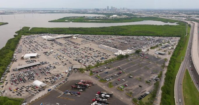 Dealer parking lot with parked used cars ready for sale. Auction reseller company selling secondhand vehicles
