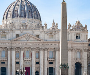 Fototapeta na wymiar Fragment of Basilica of St. Peter in the Vatican and column on Saint Peters square in Vatican