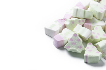 Christmas marshmallow with Christmas tree and snowman shape isolated on white background. Copy space