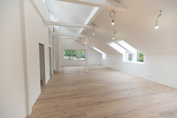bright, new loft apartment with new parquet floor, without baseboards, skirting boards, modern living