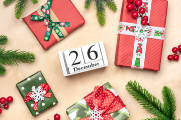 Gift boxes, wooden calendar with date December 26 on wooden background Boxing Day occurs annually...
