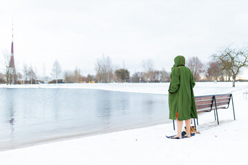 Young man is preparing for a cold winter swim, a healthy lifestyle.