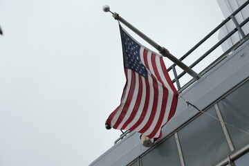 American flag at the top of the Empire State Building