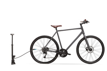 Bicycle with a flat tire and a manual bike pump