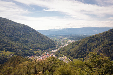 Fototapeta premium Mountain landscape with green forests and blue summer sky