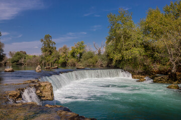 Fototapeta na wymiar Manavgat Waterfall in Turkey. It is very popular tourist attraction.