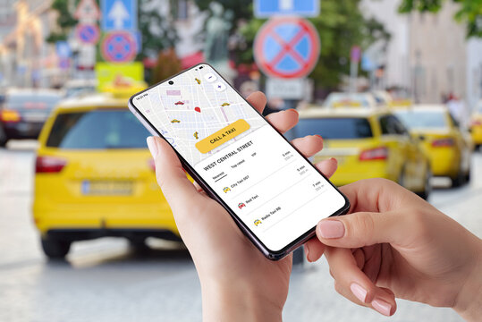 Taxi mobile app with smart maps and order button. Taxi vehicles in the background