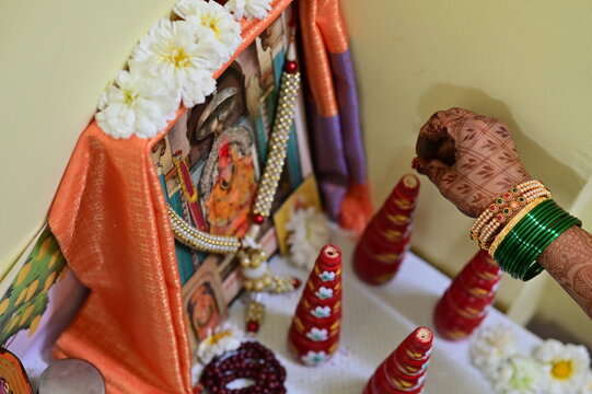 Gaurihar Pooja. Bridal wedding pooja. Marathi bride worship beautiful decorations and elements. Golden Baby Krishna and Anapurna goddess. Maharashtra culture. Maharashtra wedding rituals