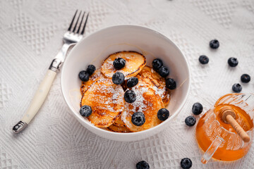 Pancake with blueberry and honey topping