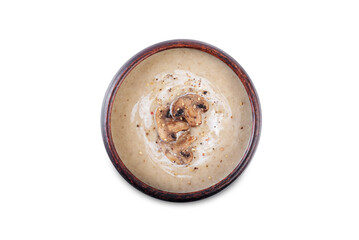 Roasted mushroom potato puree soup in a bowl on a white isolated background