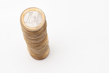 Stack of one euro coins on white background