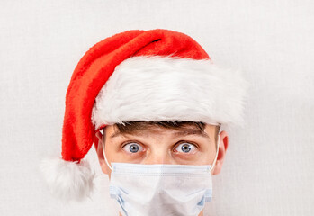 Surprised Young Man in Santa Hat
