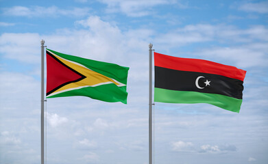 Libya and Guyana flags, country relationship concept