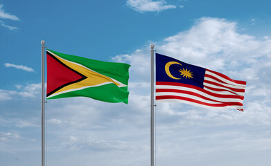 Malaysia and Guyana flags, country relationship concept