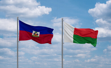 Madagascar and Haiti flags, country relationship concept
