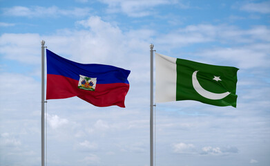Pakistan and Haiti flags, country relationship concept