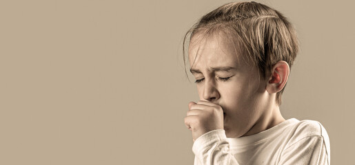 Treatment of colds and flu. Boy coughing sick colds sneezing cough. Children coughs. Child is ill,...