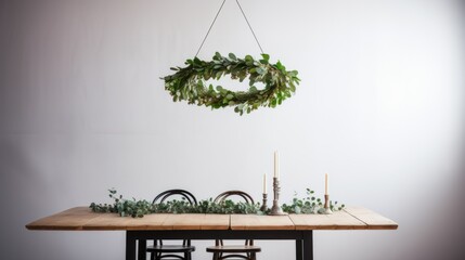 Christmas Scandinavian minimal decorations. Hanging evergreen wreath under wooden table at minimal modern white room. Modern and minimalist Christmas decor