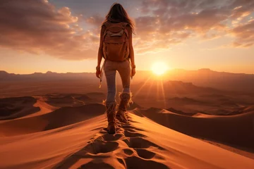 Gordijnen Beautiful woman walking in the desert. Travel and adventure concept. © Alex