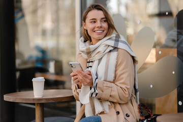 stylish woman walking in winter street