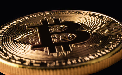 Fototapeta na wymiar Mockup golden bitcoin close up on black background with clipping path. Bitcoin or BTC is the most popular cryptocurrency in the world powered by blockchain technology. Bitcoin, the digital currency.