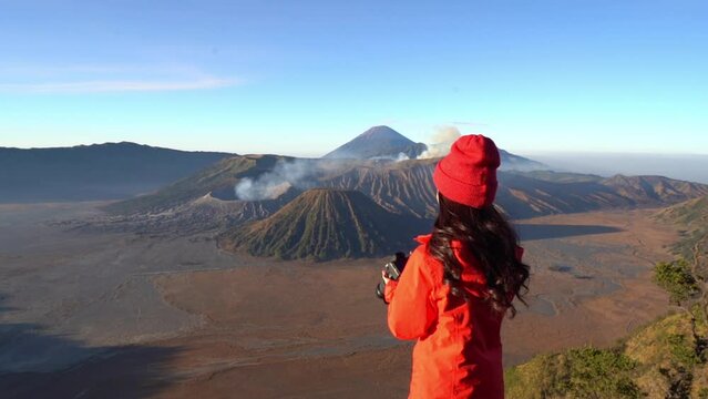 tourist Take pictures of Mount Bromo active volcano Located in Bromo. Tengger City Semeru National Park, East Java, Indonesia
