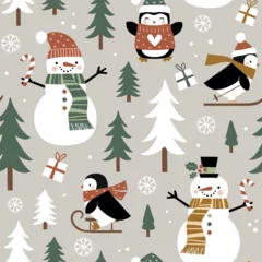 Seamless vector pattern with cute winter penguins, snowmen, snowflakes and pine trees. Hand drawn  Christmas wallpaper design. Perfect for textile, wallpaper or nursery print design. © MirabellePrint