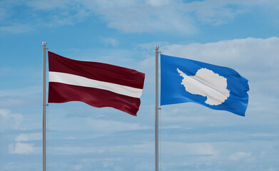 Latvia and Antarctica flags, country relationship concept
