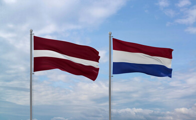 Netherlands and Latvia flags, country relationship concept