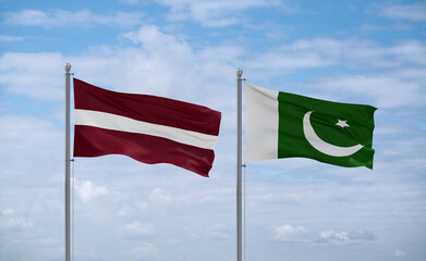 Pakistan and Latvia flags, country relationship concept