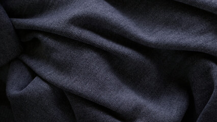 Dark texture of the fabric with folds
