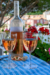 Glasses of cold rose Cote de Provence wine in yacht harbour of Port Grimaud, summer vacation on French Riviera in Provence, France