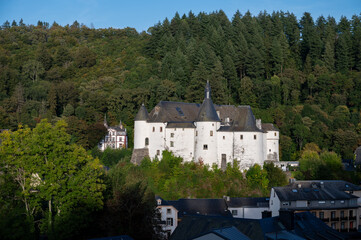 Fototapeta na wymiar Views of Clervaux commune with town status in northern Luxembourg, capital of canton of Clervaux, white castle on sunset