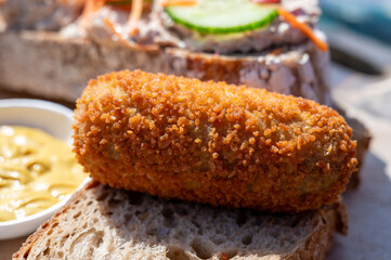 Dutch fast food, deep fried croquettes filled with ground beef meat served on bread