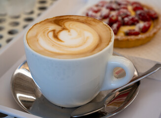 Fresh brewed coffee cappuccino in italian bar, in white cup, morning coffee