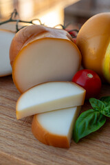 Italian semi hard handmade smoked scamorza cheese, from cow milk from Apulia or Calabria regions close up